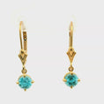 Load and play video in Gallery viewer, 14K Yellow Gold Blue Zircon Leverback Earrings