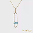 Load and play video in Gallery viewer, 14K Yellow Gold and Diamond Pendant with Emerald Cut Blue Topaz

